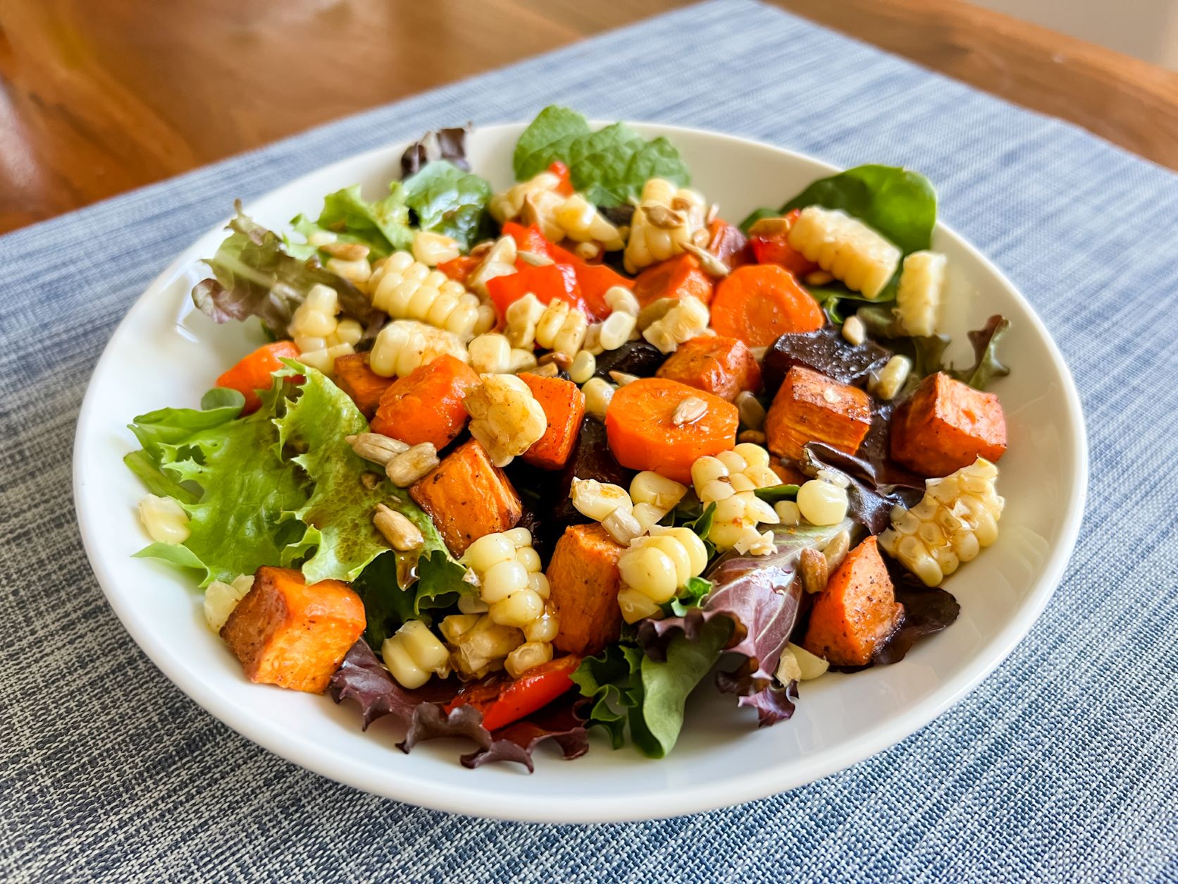 Roasted Vegetable Salad with Chipotle Dressing in a white bowl
